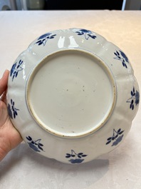 A pair of Chinese blue and white lotus-form 'grasshopper' plates, Kangxi