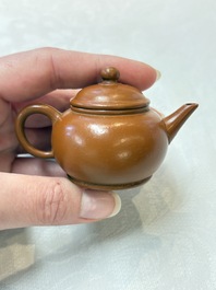A small Chinese Yixing stoneware covered teapot and two Swatow Yixing-style covered teapots, Yixing Hui Mengchen 宜興惠孟臣製 and Shunji 順記 marks, 19/20th C