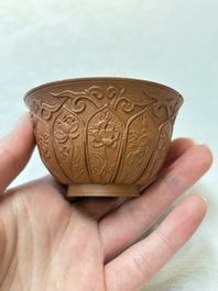 A set of five Chinese Yixing stoneware cups with floral design, Kangxi