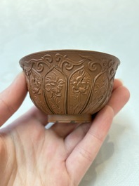 A set of five Chinese Yixing stoneware cups with floral design, Kangxi