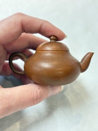 A small Chinese Yixing stoneware covered teapot and two Swatow Yixing-style covered teapots, Yixing Hui Mengchen 宜興惠孟臣製 and Shunji 順記 marks, 19/20th C