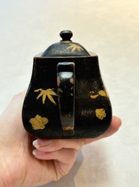 A Chinese gilt and black-lacquered Yixing teapot and cover, Qianlong mark and of the period