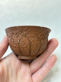 A set of five Chinese Yixing stoneware cups with floral design, Kangxi