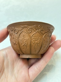 A set of five Chinese Yixing stoneware cups with floral design, Kangxi
