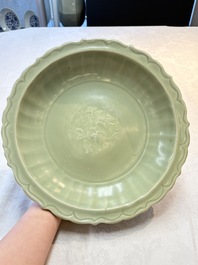 A Chinese Longquan celadon dish with floral anhua design and a 'twin fish' plate, Ming