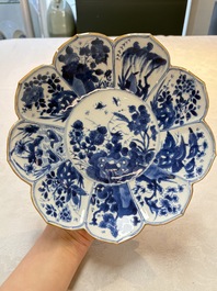 A pair of Chinese blue and white lotus-form 'grasshopper' plates, Kangxi