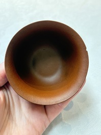 A set of five Chinese Yixing stoneware cups with floral design, Kangxi