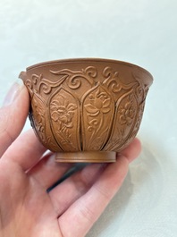 A set of five Chinese Yixing stoneware cups with floral design, Kangxi