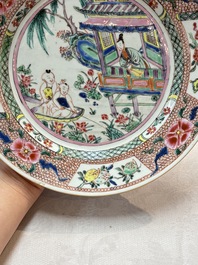 A pair of Chinese famille rose plates with a lady and boys in a boat, Yongzheng/Qianlong