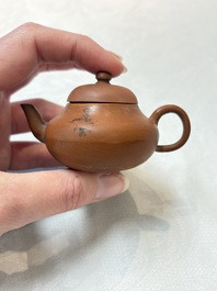 A small Chinese Yixing stoneware covered teapot and two Swatow Yixing-style covered teapots, Yixing Hui Mengchen 宜興惠孟臣製 and Shunji 順記 marks, 19/20th C
