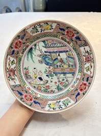 A pair of Chinese famille rose plates with a lady and boys in a boat, Yongzheng/Qianlong
