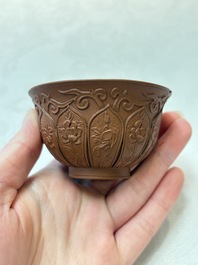 A set of five Chinese Yixing stoneware cups with floral design, Kangxi