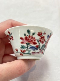 Two Chinese famille rose cups and saucers with birds and flowering branches, Yongzheng