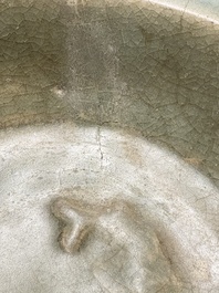 A Chinese Longquan celadon dish with floral anhua design and a 'twin fish' plate, Ming