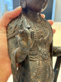 A fine and large Chinese bronze standing Buddha, possibly Liao