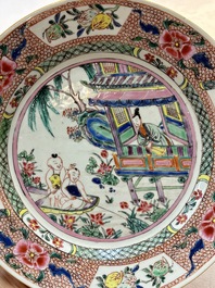 A pair of Chinese famille rose plates with a lady and boys in a boat, Yongzheng/Qianlong