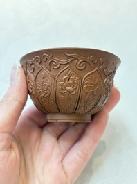 A set of five Chinese Yixing stoneware cups with floral design, Kangxi