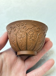 A set of five Chinese Yixing stoneware cups with floral design, Kangxi