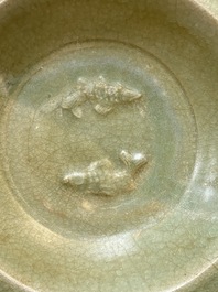 A Chinese Longquan celadon dish with floral anhua design and a 'twin fish' plate, Ming