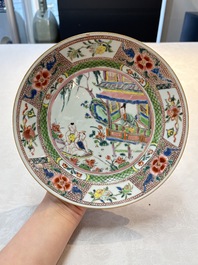 A pair of Chinese famille rose plates with a lady and boys in a boat, Yongzheng/Qianlong