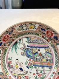 A pair of Chinese famille rose plates with a lady and boys in a boat, Yongzheng/Qianlong