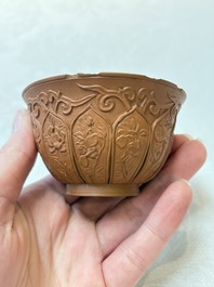 A set of five Chinese Yixing stoneware cups with floral design, Kangxi