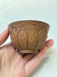 A set of five Chinese Yixing stoneware cups with floral design, Kangxi