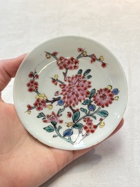 Two Chinese famille rose 'birds on flowering branches' cups and saucers, Yongzheng