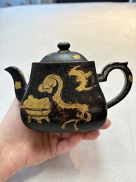 A Chinese gilt and black-lacquered Yixing teapot and cover, Qianlong mark and of the period