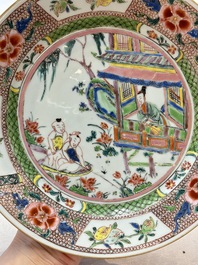 A pair of Chinese famille rose plates with a lady and boys in a boat, Yongzheng/Qianlong