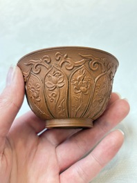 A set of five Chinese Yixing stoneware cups with floral design, Kangxi