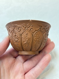 A set of five Chinese Yixing stoneware cups with floral design, Kangxi
