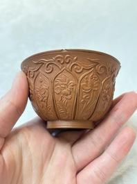 A set of five Chinese Yixing stoneware cups with floral design, Kangxi