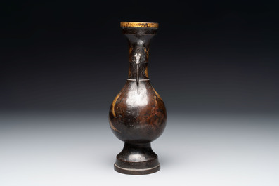 A Chinese parcel-gilt bronze vase with dragon-form handles, Yuan/Ming