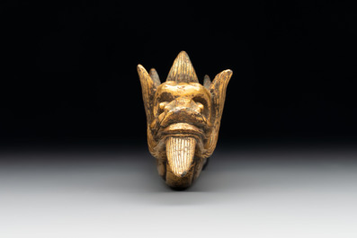 A Chinese gilt-bronze ornament in the form of a dragon, 18th C.
