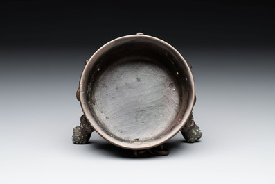A Chinese bronze tripod censer and cover, Sui/Tang