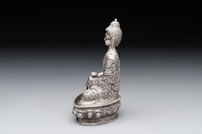 A fine Nepalese silver Buddha, 20th C.