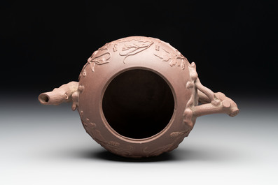 A Chinese Yixing stoneware 'squirrels among grapevines' teapot and cover, Kangxi