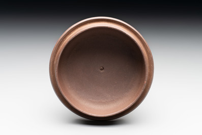 A Chinese Yixing stoneware 'squirrels among grapevines' teapot and cover, Kangxi