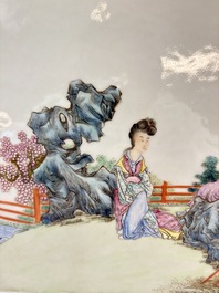 A Chinese famille rose plaque with a sage and a lady in a garden, signed Huang Can 黃燦, Republic