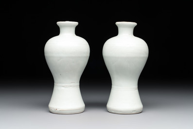 A pair of Chinese white-glazed vases and a pair of blue and white covered jars, Wanli mark and of the period