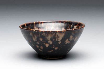 A Chinese Jizhou tortoiseshell-glazed tea bowl, a ewer and a black-glazed vase, Jin and later