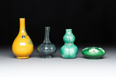 Four Chinese monochrome wares and two wooden stands, 19th C.