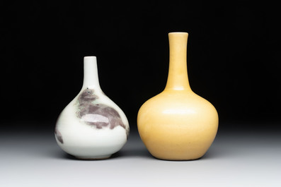 A Chinese copper-red 'mythical beasts' vase and a yellow-glazed bottle vase, with two wooden stands, Kangxi and later