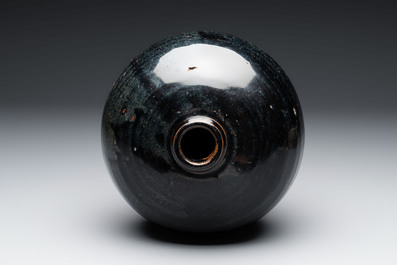A Chinese Jizhou tortoiseshell-glazed tea bowl, a ewer and a black-glazed vase, Jin and later