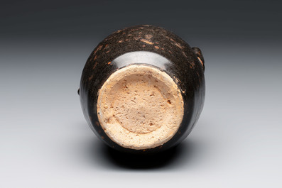A Chinese Jizhou tortoiseshell-glazed tea bowl, a ewer and a black-glazed vase, Jin and later