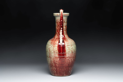 A Chinese peachbloom-glazed vase with dragon-form handles, 18th C.