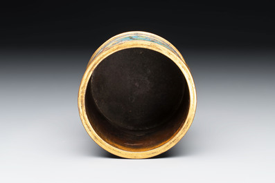 A Chinese cloisonn&eacute; cylindrical tripod censer with lotus scrolls, Qianlong mark and of the period