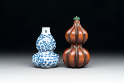 A Chinese blue and white double-gourd snuff bottle and a huali snuff bottle, Xuande and Qianlong mark, 18th C.