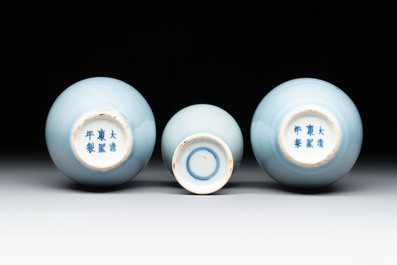 Three Chinese claire-de-lune vases on wooden stands, Kangxi mark, 19th C.